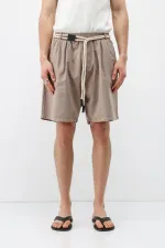 Short oversize en lin couleur pierre, ceinturé