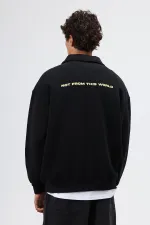 Sweat-shirt noir oversize à col polo imprimé délavé