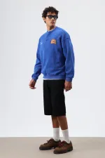 Sweat-shirt oversize à col rond imprimé bleu marine