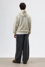 Sweat à capuche oversize beige avec détails brodés