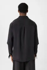 Chemise noire oversize à double manche