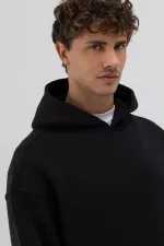 Sweat-shirt à capuche oversize imprimé noir