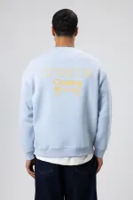 Sweat-shirt oversize à col rond imprimé bleu ciel