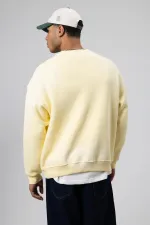 Sweat-shirt jaune oversize imprimé et délavé