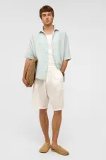 Chemise oversize à manches courtes en mousseline, bleue