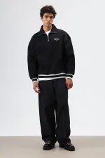 Sweat-shirt noir oversize à col polo