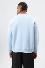 Sweat-shirt oversize bleu ciel à détails pierre délavée