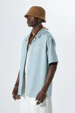 Yıkamalı Oversize Arka Baskılı Kısa Kol Cepsiz Gömlek Açık Gri