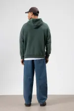 Sweat à capuche oversize à imprimé délavé vert foncé