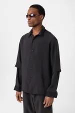Chemise noire oversize à double manche