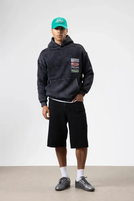 Sweat à capuche oversize noir à imprimé délavé
