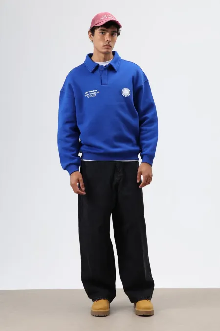 Sweat-shirt oversize à col polo imprimé délavé bleu marine