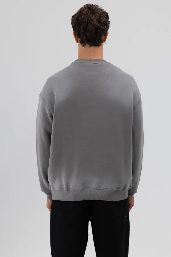 Sweat-shirt noir oversize imprimé délavé