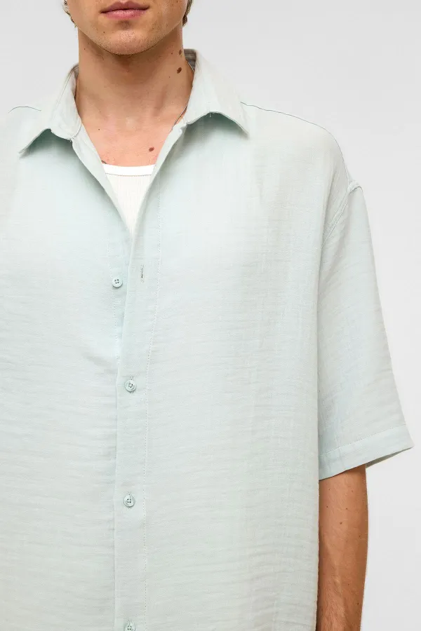 Chemise oversize à manches courtes en mousseline, bleue