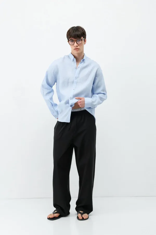 Pantalon ample en lin noir avec taille élastiquée