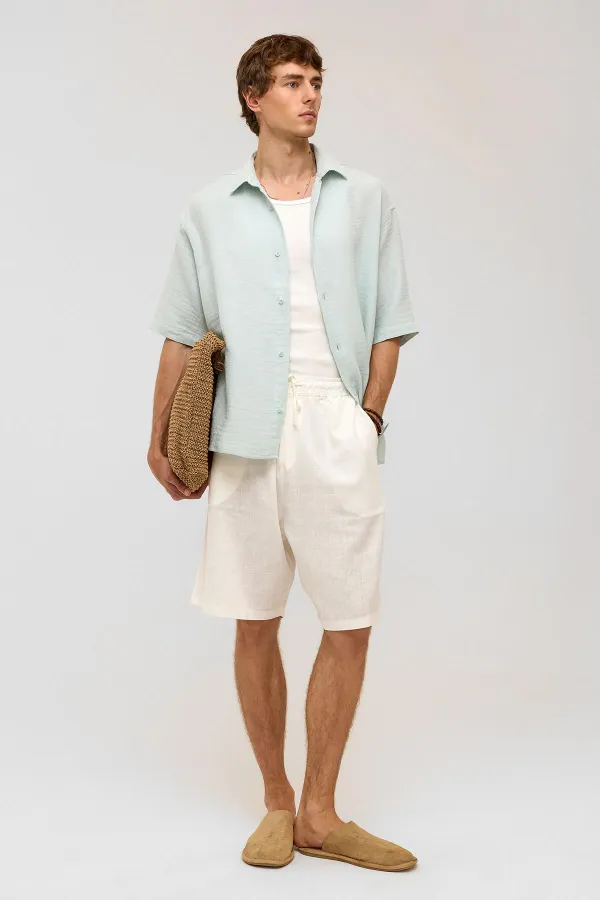 Chemise oversize à manches courtes en mousseline, bleue