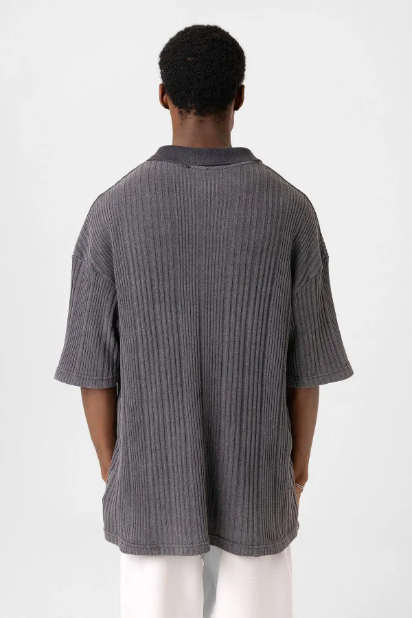 Polo à col oversize en maille noire