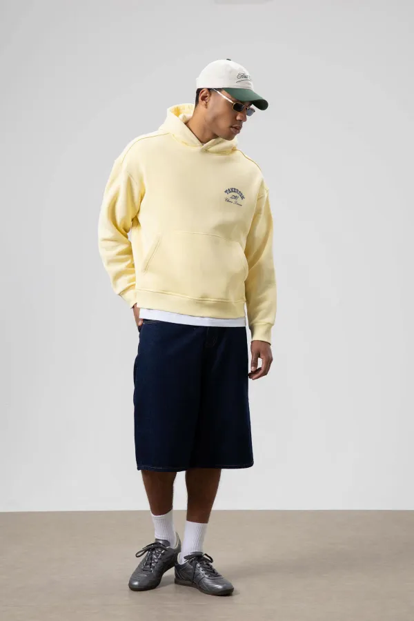 Sweat à capuche jaune oversize délavé à coupe carrée
