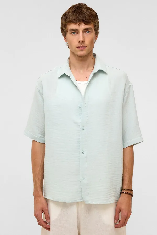 Chemise oversize à manches courtes en mousseline, bleue