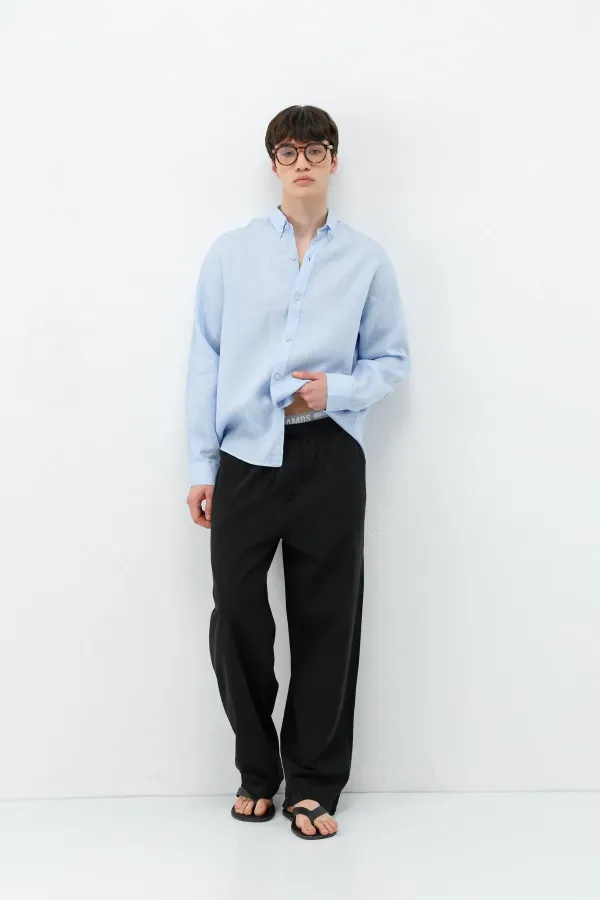 Pantalon ample en lin noir avec taille élastiquée