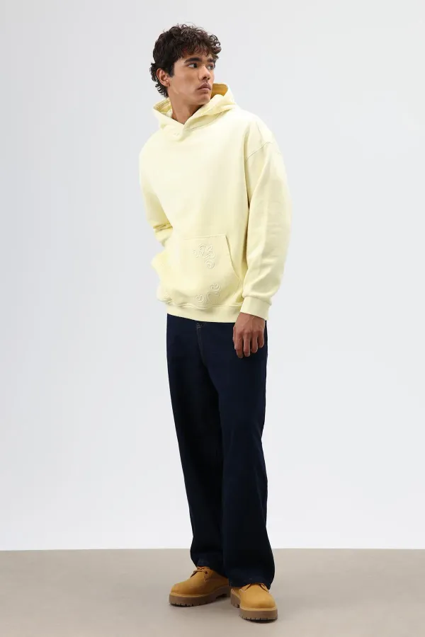 Sweat à capuche oversize jaune avec détails brodés