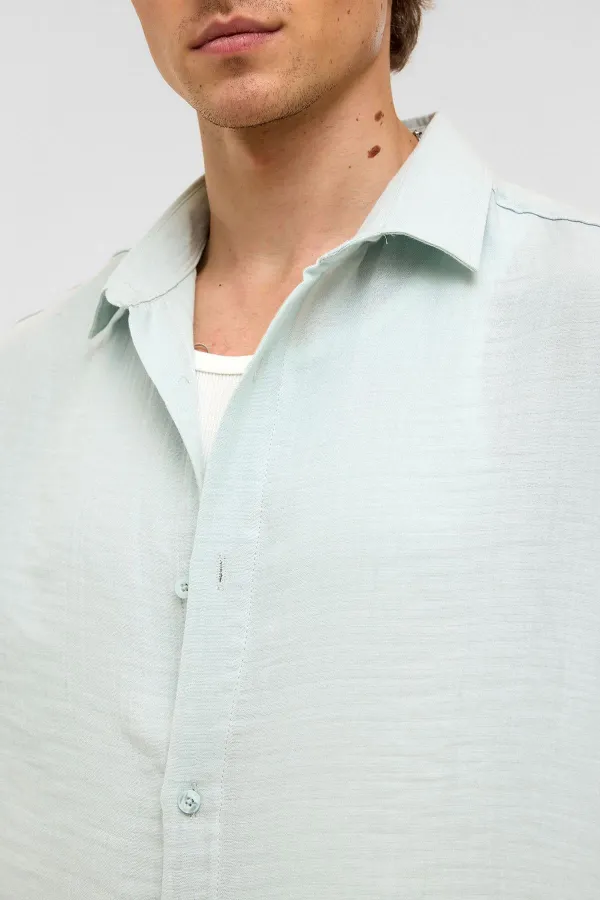 Chemise oversize à manches courtes en mousseline, bleue