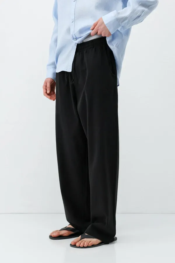 Pantalon ample en lin noir avec taille élastiquée