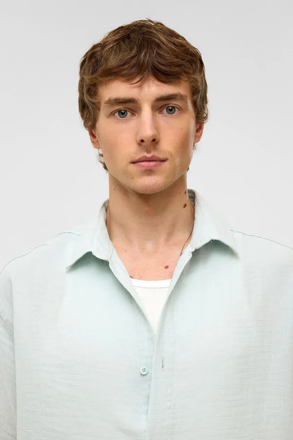 Chemise oversize à manches courtes en mousseline, bleue