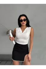 Chemisier noir sans manches drapé à col en V pour femme