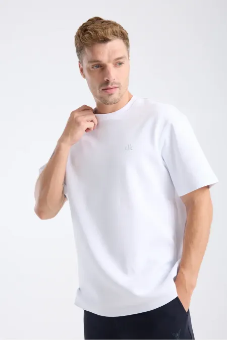 T-shirt blanc à manches courtes et coupe ample pour homme