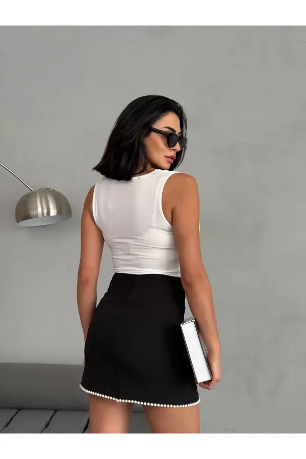 Chemisier noir sans manches drapé à col en V pour femme