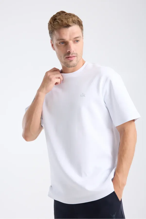 T-shirt blanc à manches courtes et coupe ample pour homme