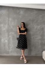 Robe Topshow noire à col bateau et décolleté en gros