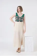 Robe Topshow en lin à bretelles et application de pierres émeraude