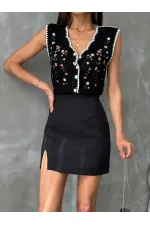 Gilet noir brodé Topshow en gros