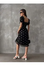 Robe Topshow noire à col bateau et décolleté en gros