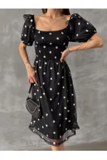Robe Topshow noire à col bateau et décolleté en gros