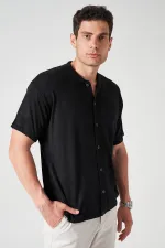 Chemise en maille de coton noire à manches courtes pour homme