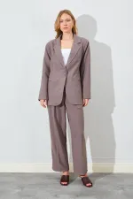 Blazer pour femme en vison à quatre boutons et poches passepoilées