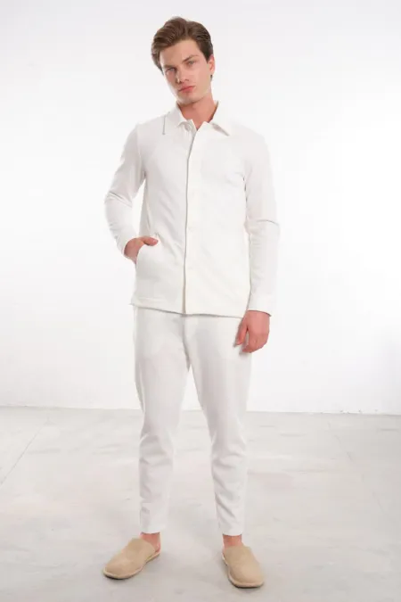 Men's Off-White Trousers with Elastic Waistband, Drawstring, and Button Closure on Back Pockets