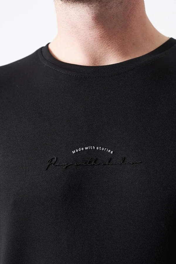 T-shirt noir à col rond en modal pour homme avec impression « MADE WITH »