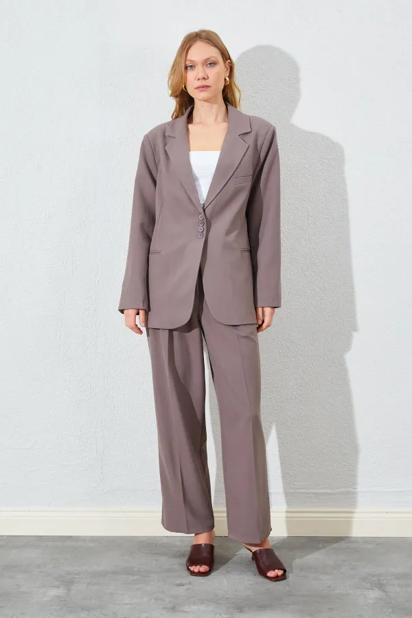 Blazer pour femme en vison à quatre boutons et poches passepoilées