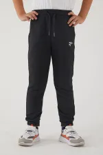 Pantalon de survêtement pour filles en tissu 3 fils avec poches, taille et chevilles élastiques, et motif imprimé