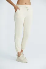 Pantalon de survêtement basique pour femme en lycra 2 fils, coupe classique, avec poignets élastiqués