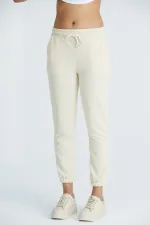 Pantalon de survêtement basique pour femme en lycra 2 fils, coupe classique, avec poignets élastiqués