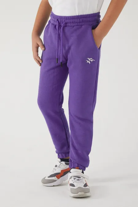 Pantalon de survêtement pour filles en tissu 3 fils avec poches, taille et chevilles élastiques, et motif imprimé