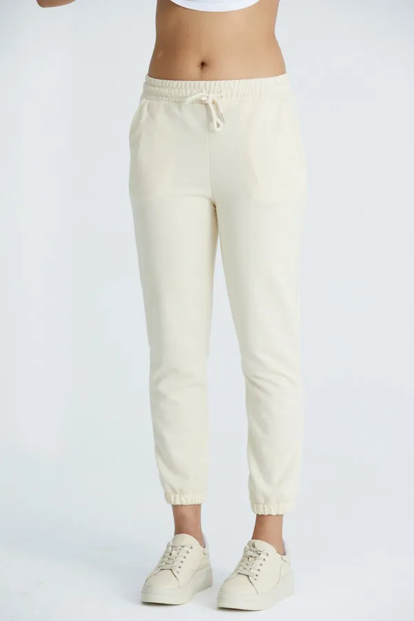 Pantalon de survêtement basique pour femme en lycra 2 fils, coupe classique, avec poignets élastiqués