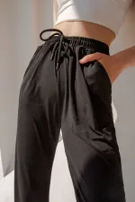 Pantalon de survêtement taille haute en lycra avec fente