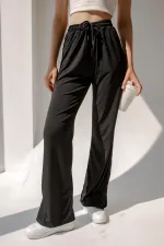 Pantalon de survêtement taille haute en lycra avec fente