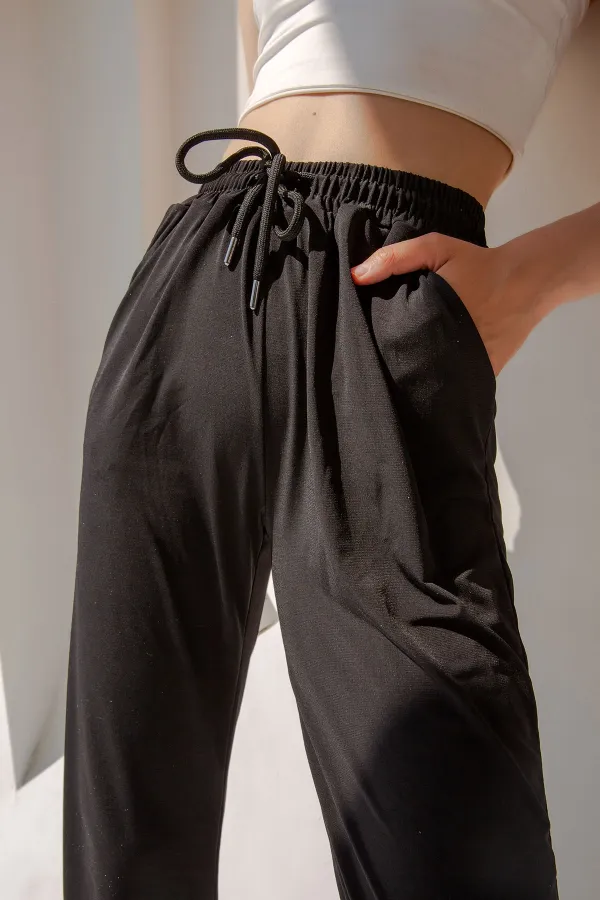 Pantalon de survêtement taille haute en lycra avec fente